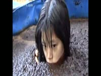 Tiny Asian girl submerged in a pool of scat
